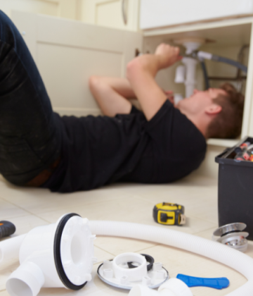 Plumber Fixing Sink